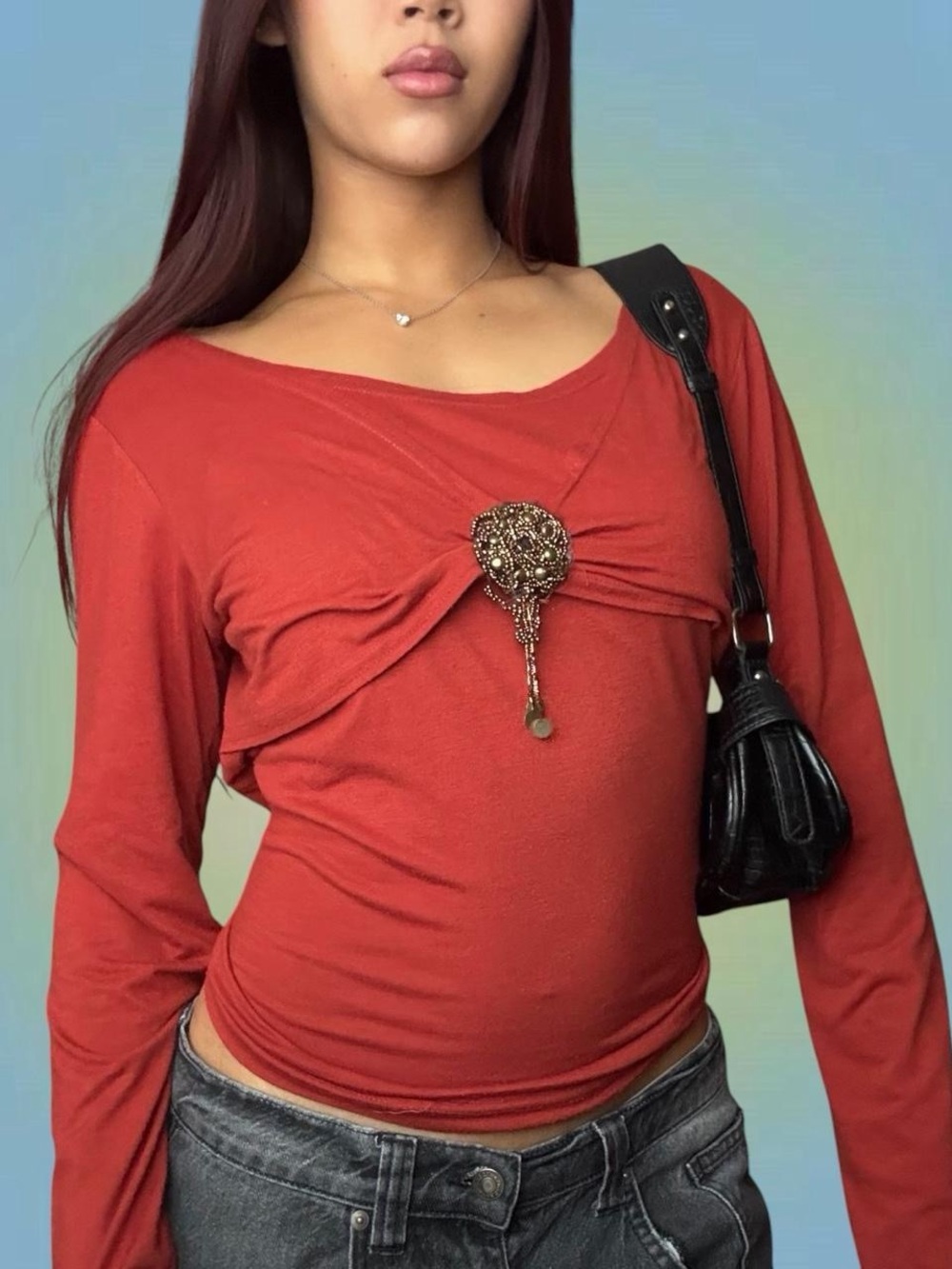 Rust Red Long-Sleeve Twist Front Top with Decorative Brooch